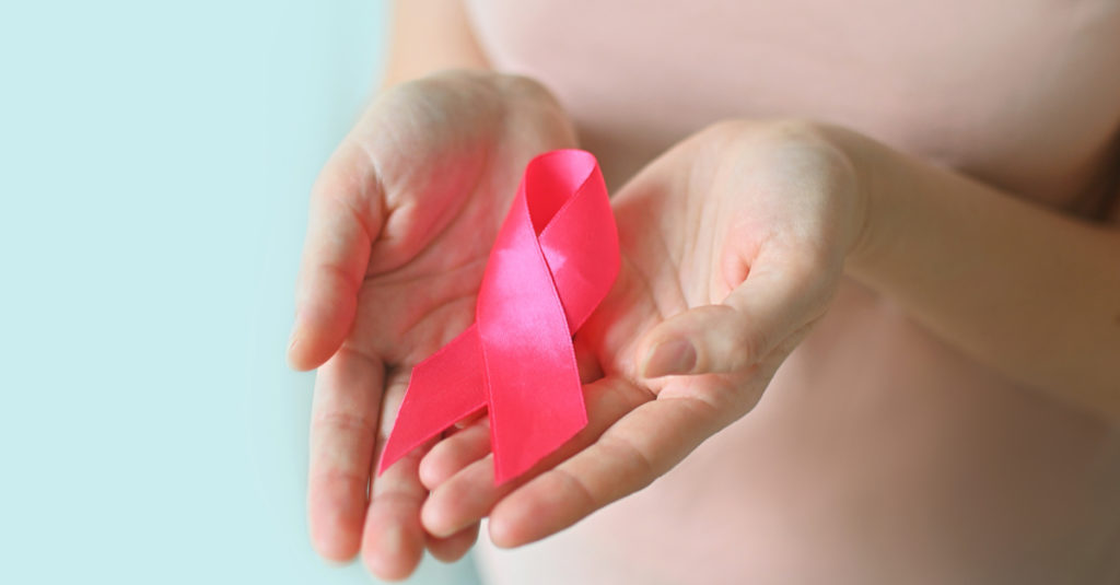 breast cancer awareness png of woman holding pink breast cancer ribbon
