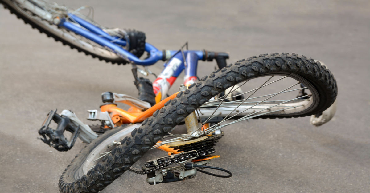 bicycle safety awareness with damaged bike after bicycle accident on road